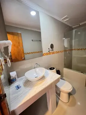 a bathroom with a sink and a toilet at Hotel Costa del Sol in Cartagena de Indias