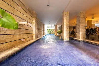an empty swimming pool with blue tiles on the floor at Madisson Boutique Hotel Cartagena in Cartagena de Indias