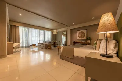 a hotel room with a bed and a living room at Madisson Boutique Hotel Cartagena in Cartagena de Indias