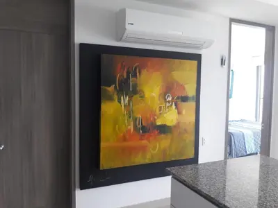 a painting is hanging on a wall in a kitchen at Morros City - Frente al mar in Cartagena de Indias