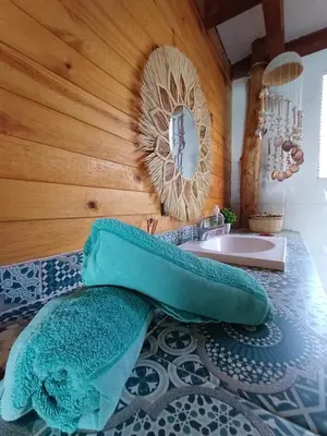 a bathroom with a sink and a mirror at The Wizard & Bar BARU in Playa Blanca