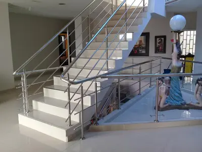 a group of girls sitting on stairs in a building at Hotel Dainner in Plato