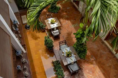 an overhead view of a restaurant with tables and chairs at Hotel Quadrifolio in Cartagena de Indias