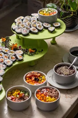a table with plates of food and bowls of food at Hotel Cartagena Plaza in Cartagena de Indias