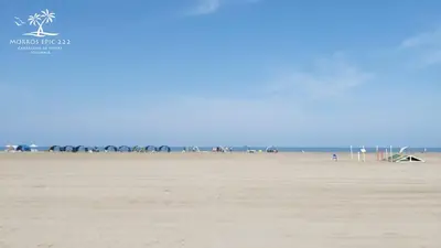 a group of people walking on the beach at Morros Epic 222 in Cartagena de Indias