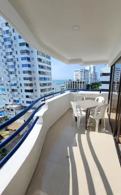 a balcony with a table and chairs on a building at Edificio Marina del Rey Cartagena in Cartagena de Indias