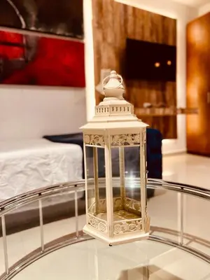 a white lantern on a glass table in a room at MORROS VITRI Luxury in Cartagena de Indias