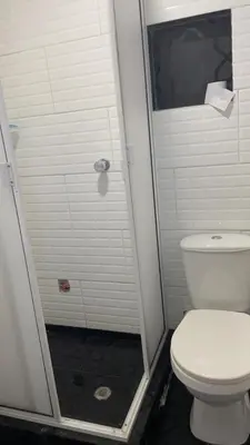 a bathroom with a toilet and a shower at Casa Vecchio in Cartagena de Indias
