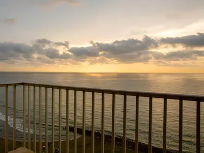a view of the ocean at sunset from a balcony at Hotel Capilla del Mar in Cartagena de Indias