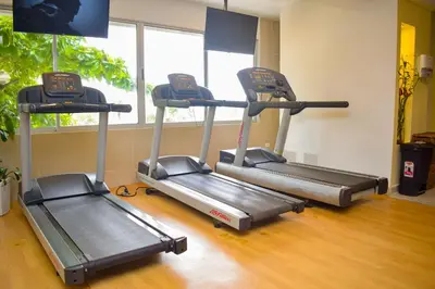 a gym with two treadmill machines in a room at Hotel Capilla del Mar in Cartagena de Indias