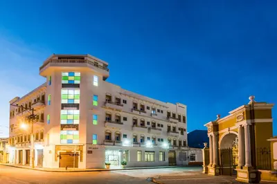 an apartment building in a city at night at Hotel Dorado Plaza Centro Histórico in Cartagena de Indias