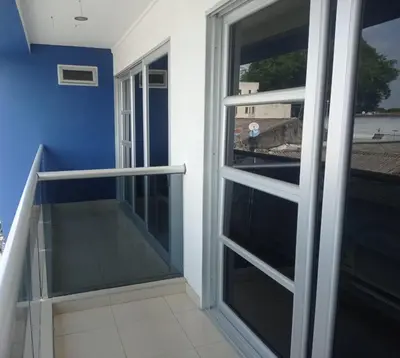 a balcony with sliding glass doors in a building at Hotel Damys in Sincelejo