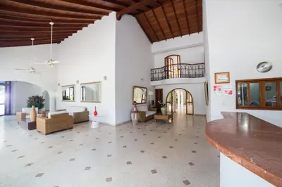 a large living room with white walls and a wooden ceiling at San Martin Cartagena in Cartagena de Indias