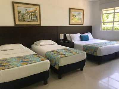 a hotel room with two beds in a room at San Martin Cartagena in Cartagena de Indias