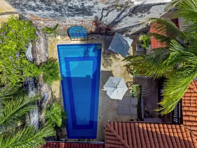 a blue door on the side of a building at El Marques Hotel Boutique By GEH Suites in Cartagena de Indias