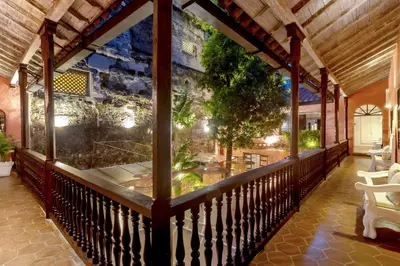 a balcony with a view of a restaurant at El Marques Hotel Boutique By GEH Suites in Cartagena de Indias