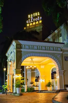 a hotel entrance with a sign on top of it at Hotel El Prado in Barranquilla