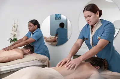 a woman in a massage room with a patient at Hotel Las Americas Casa de Playa in Cartagena de Indias