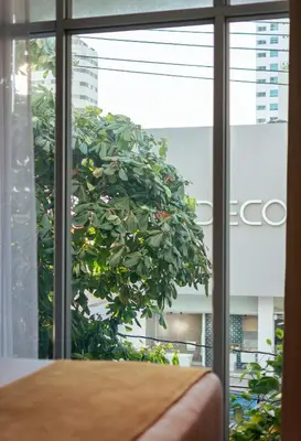a tree is seen through the window of a room at Hotel Zi One Luxury in Cartagena de Indias
