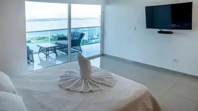 a hotel room with a bed with a fish head on it at OCEAN VIEW SPACIOUS PENTHOUSES WITH BIG TERRACES AND OVER 318 Square Meters in Cartagena de Indias
