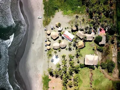 an aerial view of a resort with palm trees at Ecohotel Kocoluu in San Bernardo del Viento