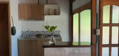 a kitchen with a counter with a vase on it at El palmar azul in San Bernardo del Viento