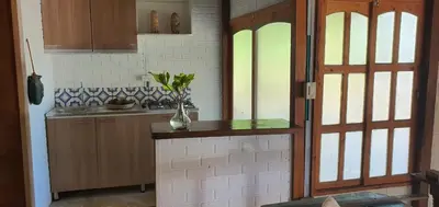 a kitchen with a counter with a vase on it at El palmar azul in San Bernardo del Viento