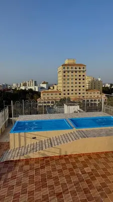 an empty swimming pool on the roof of a building at Hotel Caribe Plaza Barranquilla in Barranquilla