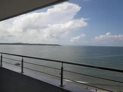 a view of the ocean from a balcony of a beach at Caribe a Vista in Cartagena de Indias