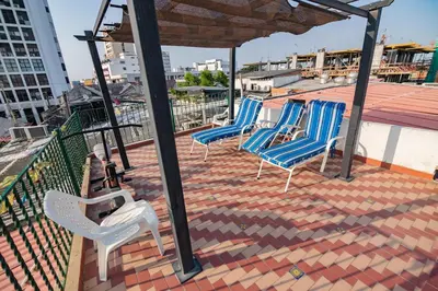 a group of chairs sitting on top of a roof at Hotel La Casona de Getsemani in Cartagena de Indias