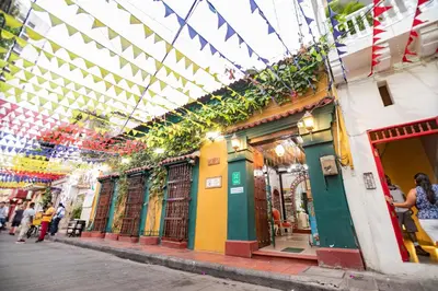 a building with people standing outside of it at Hotel La Casona de Getsemani in Cartagena de Indias