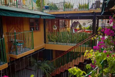 an overhead view of a building with balconies and flowers at Hotel La Casona de Getsemani in Cartagena de Indias