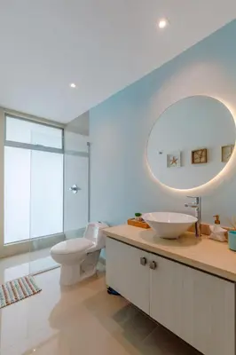 a bathroom with a sink and a toilet and a mirror at Escapada 5 estrellas frente al mar - sonest morros in Cartagena de Indias