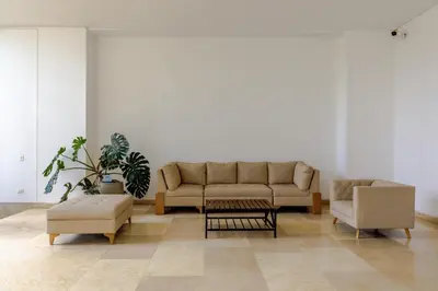 a living room with a couch and two chairs at Escapada 5 estrellas frente al mar - sonest morros in Cartagena de Indias