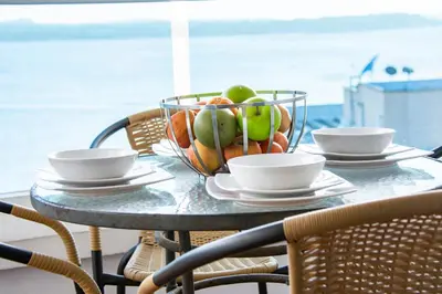 a glass table with a bowl of fruit on it at Mirador del Laguito 1201 in Cartagena de Indias
