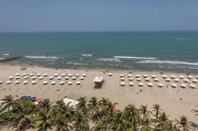 an aerial view of a beach with umbrellas and the ocean at Hotel Regatta Cartagena in Cartagena de Indias