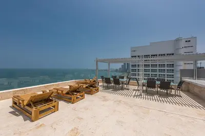 a group of tables and chairs on top of a building at Hotel Regatta Cartagena in Cartagena de Indias