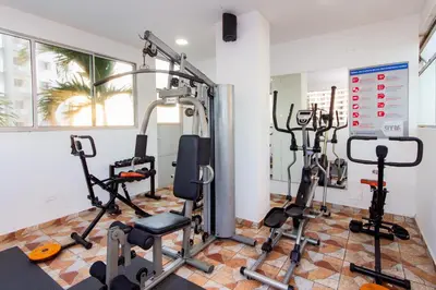 a gym with several tread machines in a room at Hotel Aixo Suites By GEH Suites in Cartagena de Indias