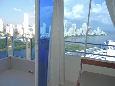 a balcony with a view of a city skyline at El Nuevo Conquistador in Cartagena de Indias