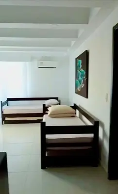 a bedroom with two beds in a room at El Nuevo Conquistador in Cartagena de Indias