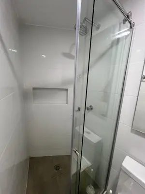 a shower with a glass door in a bathroom at El Nuevo Conquistador in Cartagena de Indias