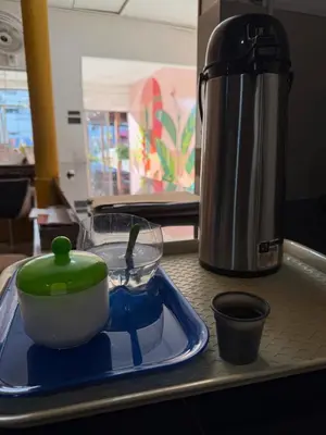 a kitchen counter with a pot and a container on a tray at Hotel Rosandy Galaxy in Cartagena de Indias