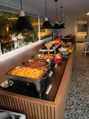 a buffet line with many different types of food at Hotel Stil Cartagena in Cartagena de Indias