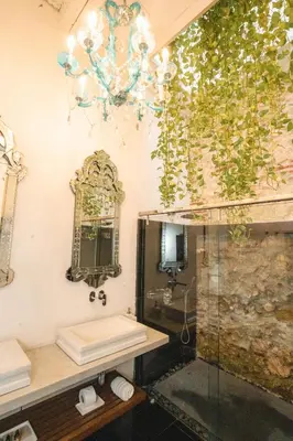 a bathroom with a sink and a mirror at Hotel Aguamarina Boutique in Cartagena de Indias