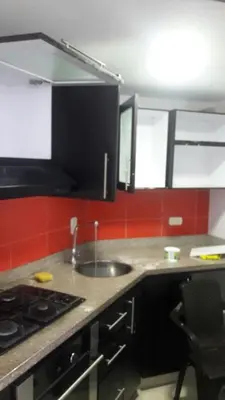 a kitchen with a sink and a stove at Hermosa vista Mar in Cartagena de Indias