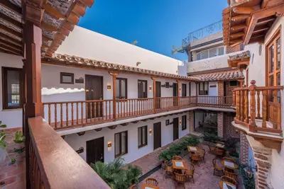 an overhead view of a building with balconies and tables at Getsemani Cartagena Hotel in Cartagena de Indias