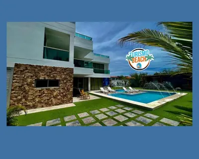 a villa with a swimming pool and a sign at Palmares Beach in Tubará