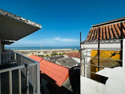 a view of the ocean from the balcony of a house at Apartamento Alvarez in Cartagena de Indias