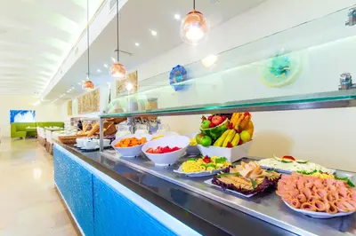 a buffet line with fruits and vegetables on display at Hotel Dann Cartagena in Cartagena de Indias
