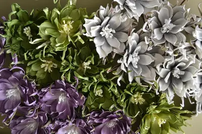 a bunch of purple and green flowers in a vase at Hotel Isla Verde in Tubará